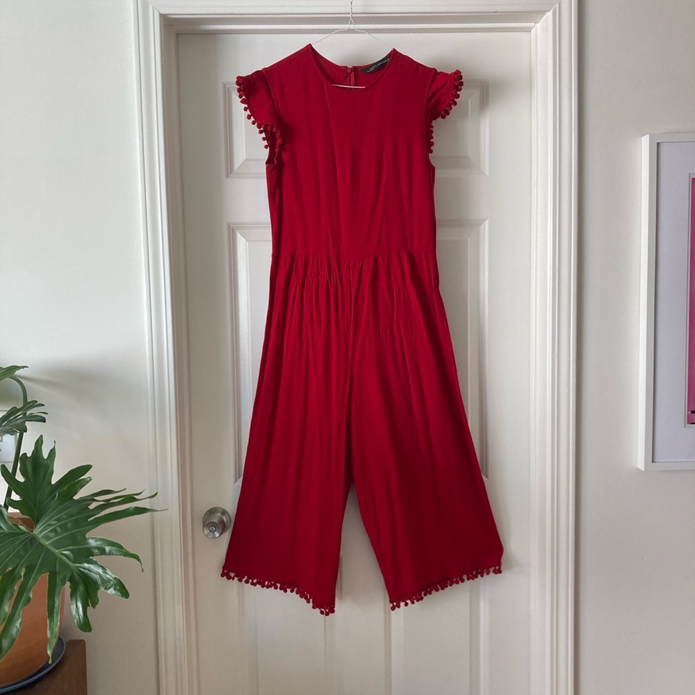 Red Jumpsuit with Pom-Pom Trim